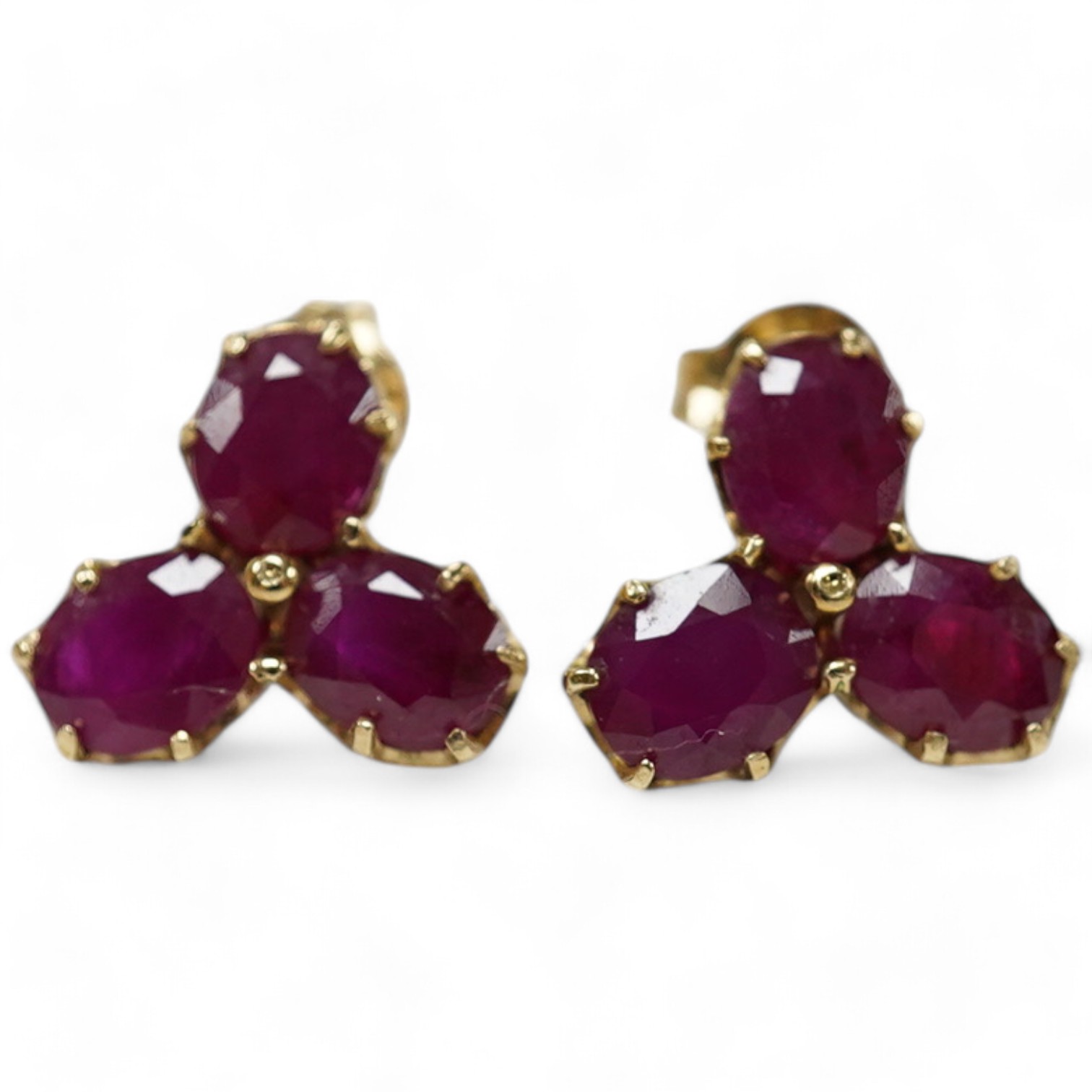 A modern pair of 9ct gold and three stone ruby cluster set ear studs, 9mm, gross weight 1.6 grams. Condition - good